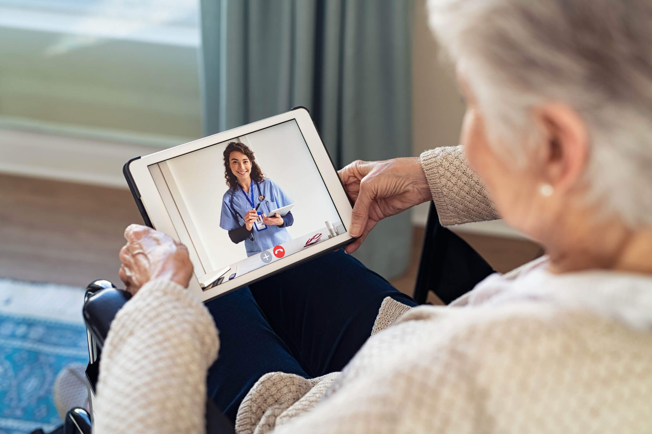 A Old Lady on Telemedicine on call wit doctor